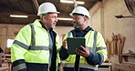 Woodworker, team and discussion in workshop with tablet, planning and research for carpentry project. Mature people, talk and production in warehouse with tech, carpenter advice and collaboration.
