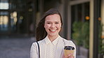 Face, businesswoman and commute in city with coffee, smile and confidence for public relations career. Happy, person and beverage in urban town with pride, PR experience and travel to work in morning