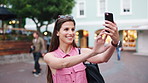 Selfie, happy and woman in city for travel blog, social media, and online post for content creation. Town, tourist and person with picture, photo and update for holiday, vacation and weekend abroad