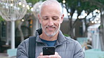 Man, phone and smile with travel in city with texting, check notification and chat with tourism vacation. Mature person, happy and scroll with mobile app, contact or post on social media on holiday