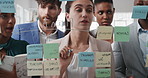 Woman, writing and group at office with glass wall, review or planning at marketing company. Business people, talk or team with board, feedback or project management for launch at advertising agency