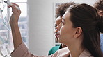 Team, writing and group with sticky notes in business, creative and planning for marketing strategy. Advertising, brand manager and happy people with ideas for project, brainstorming or collaboration