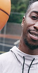 Basketball, face or man with ball spin, finger balance or athletic skill in sports practice. Smile, rain or black person on court with equipment, hand control or coordination trick in fitness hobby.