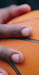 Person, hands and sport with basketball for outdoor game, match or preparation for tournament. Closeup, athlete or player getting ready with round object for score, point or goal on basket pitch