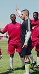 Complain, deny and ref with whistle on soccer field for control of competition, game or match. Conflict, fitness and foul with football player group of men outdoor on pitch for freekick argument