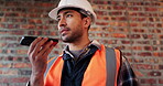 Phone, man and talking on loudspeaker at construction site with app, internet or online dictation. Asian person, technology and recording for project management, audio list or renovation at building