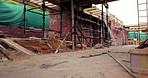 Construction, scaffolding or empty building at site, brick wall or concrete for engineering. Architecture development, exterior and incomplete infrastructure, support structure or framework design