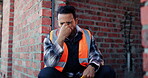 Helmet, thinking or tired man with stress at construction site, building deadline or labor pressure. Reflection, fatigue or builder with frustration for safety anxiety, burnout or development delay