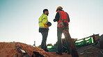 Men, team and meeting on construction site for planning, building development and space. Low angle, engineers and outdoor with discussion for inspection requirements, renovation progress and back