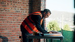 Man, blueprint and architect at construction site for engineering, planning and urban infrastructure. Floor plan, paperwork and contractor for renovation, property development and project management