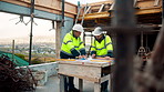 Men, engineer and blueprint at construction site, discussion and development review with team. People, paperwork and floor plan for building design, industrial architecture or problem solving in city