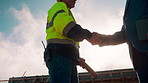 Manager, architect and handshake for deal at construction site, introduction or property partnership. Below, project agreement or people shaking hands for collaboration, labor contract and greeting 