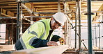 Construction, man and tape measure with wood for development, building and project with engineer. Tools, person and lumber at site for dimension accuracy, architecture and marking with pencil