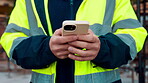Architect, texting and hands with phone at construction site, research or communication with contact. Civil engineer, outdoor and person with mobile for chat, typing and plan for property development