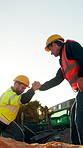 People, engineer and holding hands outdoor at excavation with help, assistance and site preparation. Team, support and secure footing for inspection, building foundation and underground construction