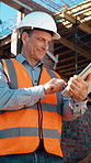 Construction site, man and engineer with tablet for building report, safety compliance or typing. Architecture, tech or mature person outdoor for development schedule, smile or project review in city