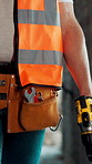 Walking, person or hands with drill at construction site, foundation development or building renovation. Manual labor, builder or power tools for infrastructure engineering, property repair or gear