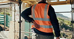 Construction site, man and back pain with ache for building, renovation and civil engineering mistake. Tired contractor, burnout and accident with industrial strain, architecture or maintenance