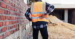 Construction, back pain or man on site with walk, spine issue or labor injury in building project. Accident, hurt or engineer with backache, muscle strain or arthritis in infrastructure development.