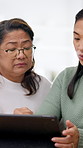Adult, daughter and teaching mother with tablet, frustration and conversation for digital literacy. Flare, senior mom and women in home with tech, assistance or learning how to search online together