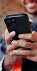 Construction, online and hands of man with phone for chat, communication and building update. Architecture, engineer and person typing on cellphone for message, contact and internet for remodeling