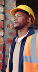 Worker, thinking or black man at construction site with PPE, engineering or vision for renovation idea. Engineer, person and reflection outdoor with building project, safety helmet or infrastructure.