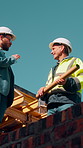 Construction, team and men talking for building development, project feedback and low angle. Engineer, planning and smile outdoor for infrastructure update, architecture or safety evaluation on site