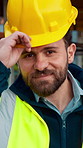 Face, man and engineer with helmet outdoor for inspection, building development and construction. Portrait, male person or hard hat for safety, industrial infrastructure and engineering for expansion