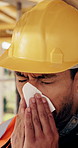Sneeze, sick and man with tissue on construction site for building, renovation and development. Engineering, architecture and person with allergies, hayfever and cold for infrastructure career