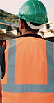 Construction, helmet and back of man with reflection, inspiration and building plan for property. Architecture, contractor and person with ppe for safety compliance, ideas and thinking for renovation