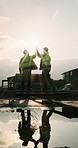Back, construction and team high five on site for foundation finish, inspection pass or support. Reflection, flare or excited men with fist pump for building progress, compliance celebration or space