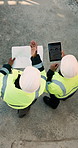 Blueprint, men and construction workers with tablet on site for planning home renovation from above. Floor plan, technology and male civil engineers in discussion for repairs, maintenance or building
