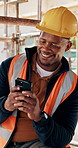 Construction, man and happy with phone on site for inspection approval, delivery email or thinking. Foreman, black person or smile with mobile app for timesheet review, weather clearance or good news