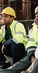 Construction, eating and men with lunch at site for break, relax and conversation by building. Architecture, friends and people with food, snack and healthy meal for energy for infrastructure project