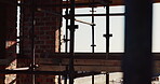 Building, scaffolding or planks on construction site for renovation, engineering or structure stability. Empty, worksite or beams on infrastructure for urban development, property expansion or design