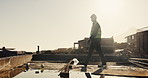 Engineer, man and walking outdoor for construction, inspection and planning for architecture. Flare, male person and thinking with view for quality assurance, building progress and urban development