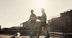 Engineer, people and walk outdoor for construction, inspection or planning for infrastructure. Team, discussion and pointing at worksite for quality assurance, building progress and urban development