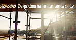 Building, scaffolding and people on construction site for renovation, property expansion and safety. Sunshine, worksite and workers at infrastructure for urban development, engineering or maintenance