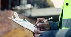 Hands, writing and engineer with clipboard for construction, inspection and compliance for safety. Person, supervisor and notes with checklist, quality assurance and information for building progress