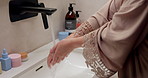 Bathroom, washing and hands of woman with water for hygiene, wellness and cleaning for self care. Home, morning and person with stream, soap and faucet for bacteria, grooming and germ protection