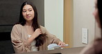 Mirror, self care and woman brushing hair in bathroom for grooming, beauty or morning routine. Happy, reflection and Asian female person with hairstyle for daily haircare treatment in apartment.