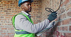 Clipboard, inspection and black man with wire at construction site, compliance or infrastructure. Writing, evaluation and person with checklist for process, installation or electrical line review