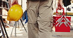 Helmet, hands and man on construction site with toolbox infrastructure and property inspection. Architecture, civil engineering and walking with PPE equipment, renovation and remodeling project