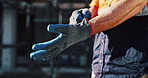 Getting ready, gloves and hands of man on construction site for architecture or civil engineering. Preparation, protection and safety with contractor outdoor for building or property development