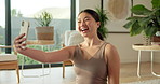 Woman, selfie and happy with fitness in home on floor with memory, post and profile picture for wellness. Asian person, influencer and photography with exercise, smile and social media at apartment