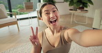 Woman, selfie and face with fitness in home with peace sign, smile and profile picture for wellness. Asian person, influencer and photography with exercise, happy or social media at house in Cambodia