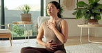 Asian woman, breathe and yoga at house with meditation, mindfulness or zen for spiritual healing. Person, eyes closed and exhale in lounge for self care, inner peace and holistic balance for wellness