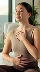 Calm, meditation and asian woman with breathing exercise for spiritual wellness or mindfulness in home. Female person, relax or nervous system with zen for emotional balance or grounding in house