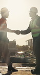 Handshake, deal and construction workers on site for city planning, agreement or negotiation. Contract, shaking hands and civil engineers with partnership for building development in urban town.