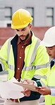 Woman, man and engineer with blueprint on rooftop, planning and building maintenance in city. People, technician and discussion with clipboard, solution and inspection with report for hvac in town